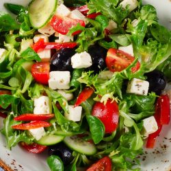 Greek salad with feta cheese. Healthy eating. Top view